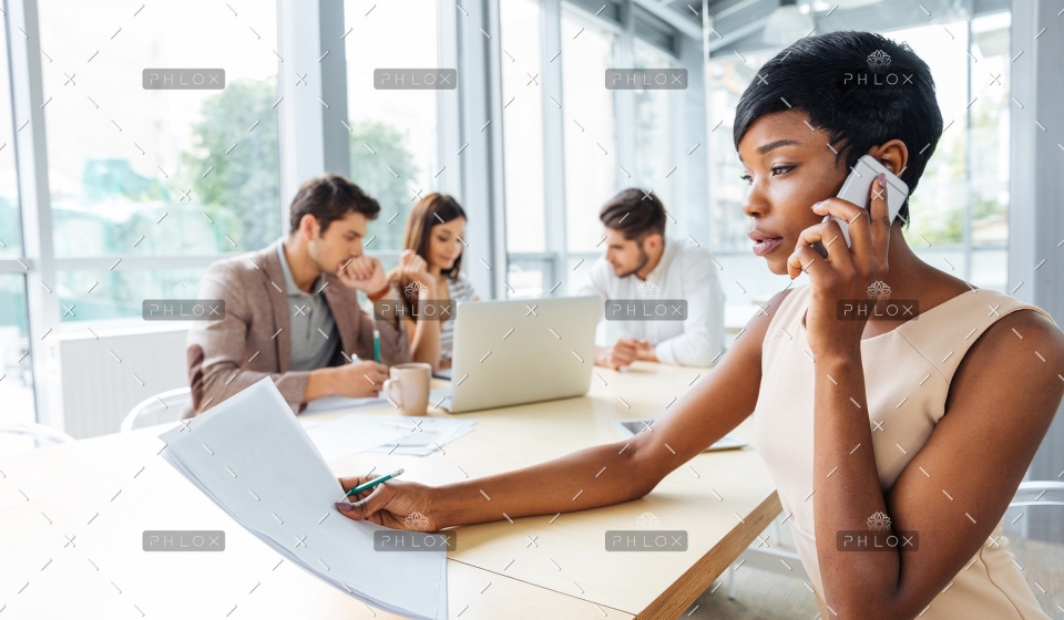 demo-attachment-478-serious-businesswoman-with-documents-talking-on-P9Q6LX6